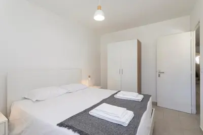 a bathroom with a sink and a shelf and a mirror at The Albufeira Concierge - Casa IÊ in Albufeira
