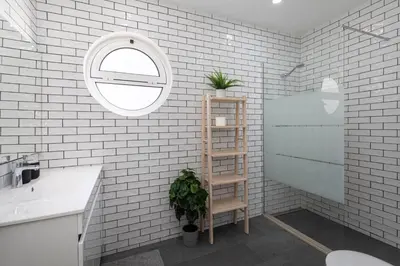 a white bathroom with a sink and a mirror at The Albufeira Concierge - Casa IÊ in Albufeira