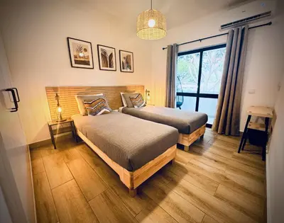 a bedroom with two beds and a window at Vilamoura 2 Bedroom with Pool - Na Casa De Pascal in Vilamoura