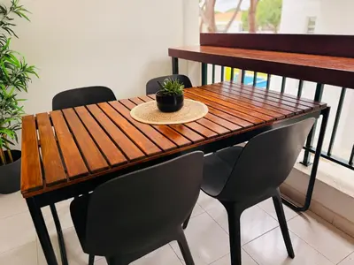 a swimming pool with blue water in a park at Vilamoura 2 Bedroom with Pool - Na Casa De Pascal in Vilamoura
