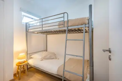 two beds in a room with white walls at Balaia 3BR Sunny Terrace in Albufeira