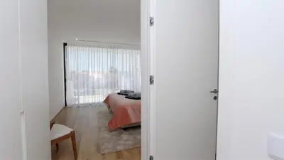 a bedroom with a bed and a window at OneSixOne-Cleverdetails, Luxury villa, Sleeps 8 adults 2 children, Private pool and Jacuzzi in Vilamoura