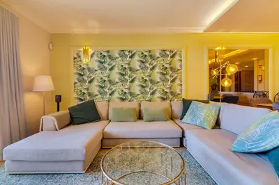 a living room with a couch and a table at AL - Apartamento Vila Sol Village in Cabeço de Câmara
