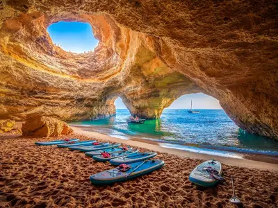 a group of kayaks lined up on the beach at V4, Villa Jardins Branqueira7 near Beach, Albufeira in Albufeira