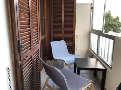 a room with two chairs and a table and a window at ALEXA APARTMENT T2, Albufeira Center two bedrooms Self check-in in Albufeira