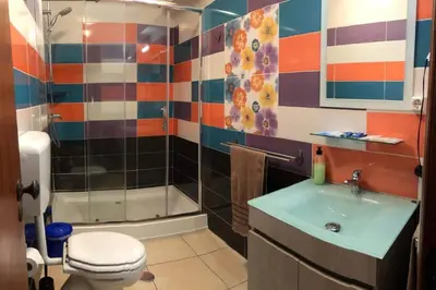 a bathroom with a shower and a toilet and a sink at ALEXA APARTMENT T2, Albufeira Center two bedrooms Self check-in in Albufeira
