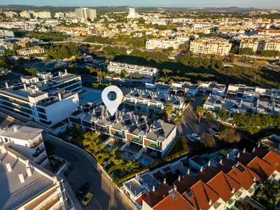 an aerial view of a city with buildings at Casa ALBUFEIRA SUNSET in Albufeira