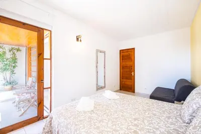 a bedroom with a bed and a window at Entire Apartment 5min from Oura Beach in Albufeira