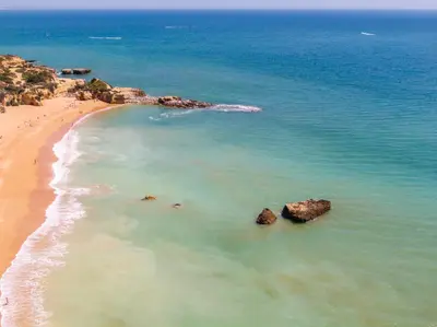 an aerial view of a beach with rocks in the water at Entire Apartment 5min from Oura Beach in Albufeira