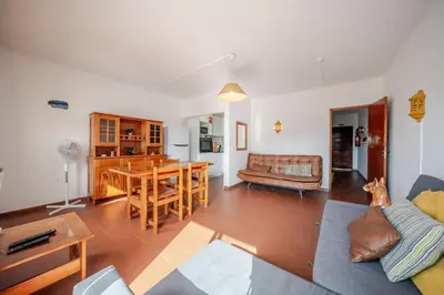 a living room with a couch and a table at BeGuest Albufeira Visconde Apartment in Albufeira