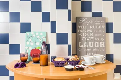 a table with a bunch of food and drinks on it at D_Loft in Albufeira