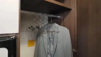 a shirt is hanging on a rack in a bathroom at Portugals Infinity - AutoCaravana Luxo in Faro