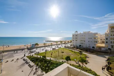 a view of a beach with buildings and the ocean at Nascente Sea View @Homesbyfc in Quarteira
