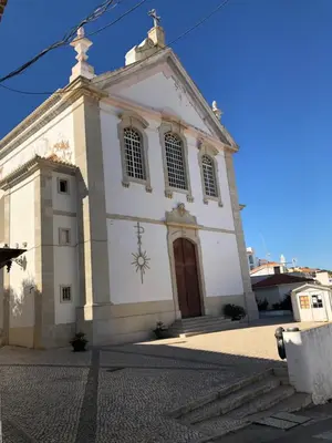 a large white church with a large door at Apartamento Flor de Amendoeira in Albufeira