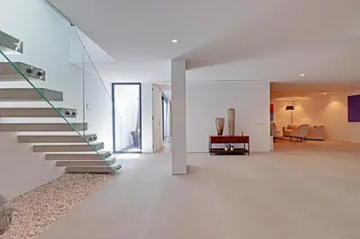 a hallway of a house with a staircase at One Six Villa in Vilamoura