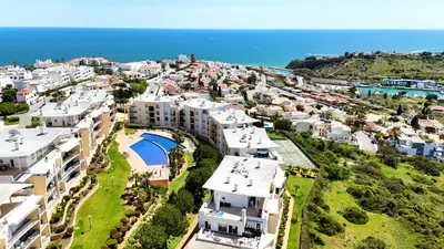 an aerial view of a city with houses and the ocean at AlbufeiraOrada Garden by Be Cherish in Albufeira