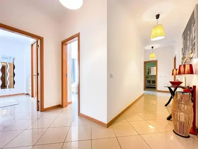 a hallway with white walls and a large doorway at AlbufeiraOrada Garden by Be Cherish in Albufeira