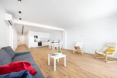 a living room with a couch and a table at Alfamar Inês Apartment in Albufeira