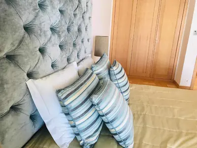 a living room with a dresser and a mirror at Marina Vilamoura Aquamar 116 By Vilamoura Sun in Vilamoura