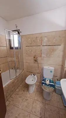 a bathroom with a toilet and a shower and a sink at ALBUFEIRA TRADICIONAL BEACH APARTMENT in Albufeira