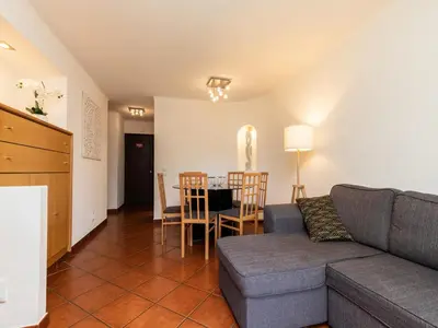 a living room with a couch and a table at Akivillas Albufeira Felicity in Albufeira