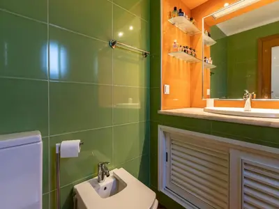 a bathroom with a sink and a toilet and a mirror at Akivillas Albufeira Felicity in Albufeira
