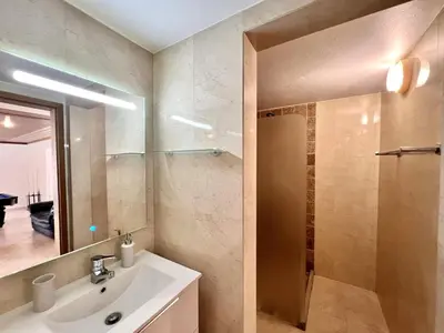a bathroom with a sink and a shower at Faro Rising by Homing in Faro