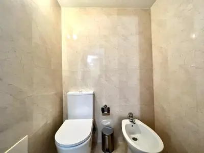 a bathroom with a toilet and a sink at Faro Rising by Homing in Faro