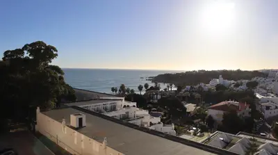 an aerial view of a city and the ocean at Bicos Beach Apartments By Albufeira Rental in Albufeira