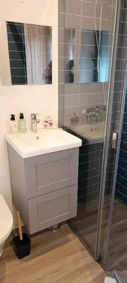 a shelf in a room with a briefcase on it at Faro Comfy Ensuite Guest House in Faro