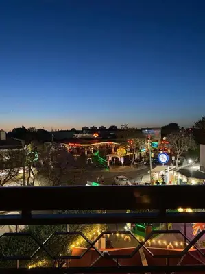 a view of a city at night with lights at Cozy Albufeira Charm in Albufeira