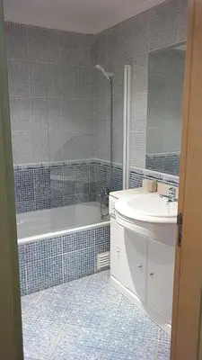 a bathroom with a tub and a sink and a bath tub at São Vicente By Albufeira Rental in Albufeira
