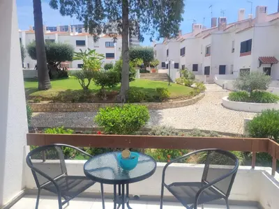 a patio with a table and chairs on a balcony at Apt-236 in Albufeira