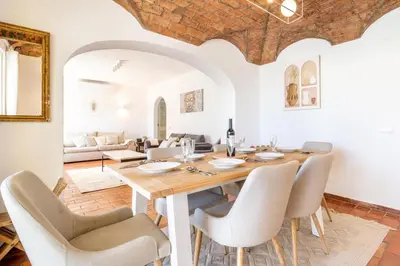a dining room with a table and chairs at Villa Bougainvilla - Vilamoura - Pool - Free wifi - Air con in Quarteira