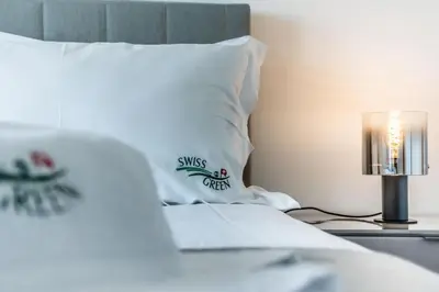 a park with a swimming pool and a building at Swiss Green Appartement Cosy et Spacieux in Quarteira
