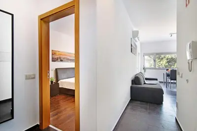 a room with a door leading to a bedroom at Apartamento Oceano in Albufeira