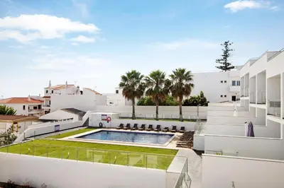 a view of the backyard of a house with a swimming pool at Apartamento Oceano in Albufeira