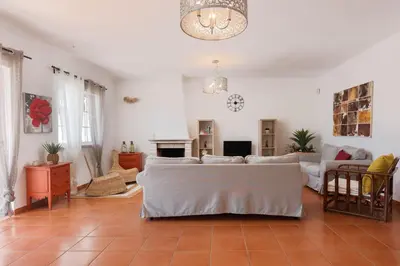 a living room with a couch and a table at JUDY - Albufeira in Albufeira