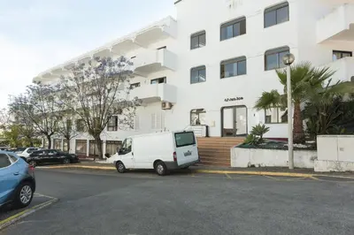 a white van parked in front of a building at Alvaflor 102 - Vilamoura by HD Properties in Vilamoura