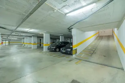 a parking garage with two cars parked in it at Albufeira Old Town Center - VERASOL 1 in Albufeira