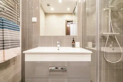 a bathroom with a white sink and a shower at Albufeira, OLD TOWN - VERASOL N in Albufeira