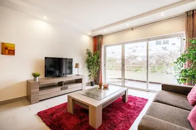 a living room with a couch and a tv at Albufeira, OLD TOWN - VERASOL N in Albufeira