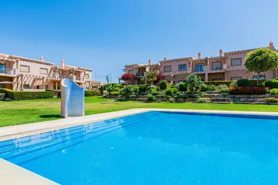 a swimming pool in front of some apartment buildings at Casa Colina 2 in Albufeira