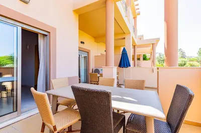 a dining room with a table and chairs at Casa Colina 2 in Albufeira