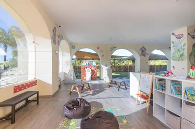 a classroom with arches and a table and chairs at Vilamoura Marina Lake in Vilamoura