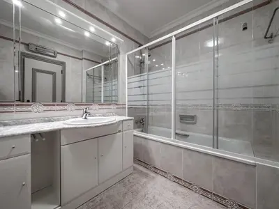 a bathroom with a shower and a sink and a tub at Luxury Apart wStunning Sea Views, Walk Beach in Albufeira