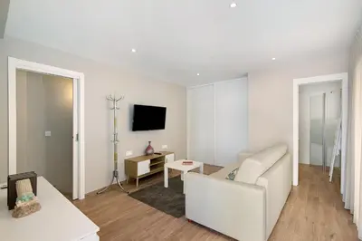 a living room with a couch and a table at A Casa da Elsa in Faro