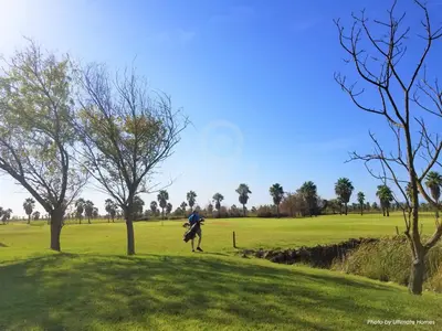 a person riding a horse in a field at SÃO RAFAEL BEACH VILLAGE 131 - Apartamento T2 Praia de São Rafael - Albufeira in Albufeira