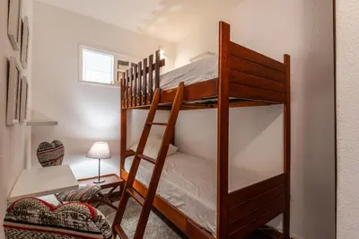 a bedroom with two bunk beds in a room at Sea View Central Town 2 Bedroom Apartment in Albufeira