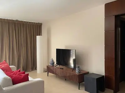 a living room with a tv and a couch at Herdade dos Salgados - 2 Bedroom in Guia